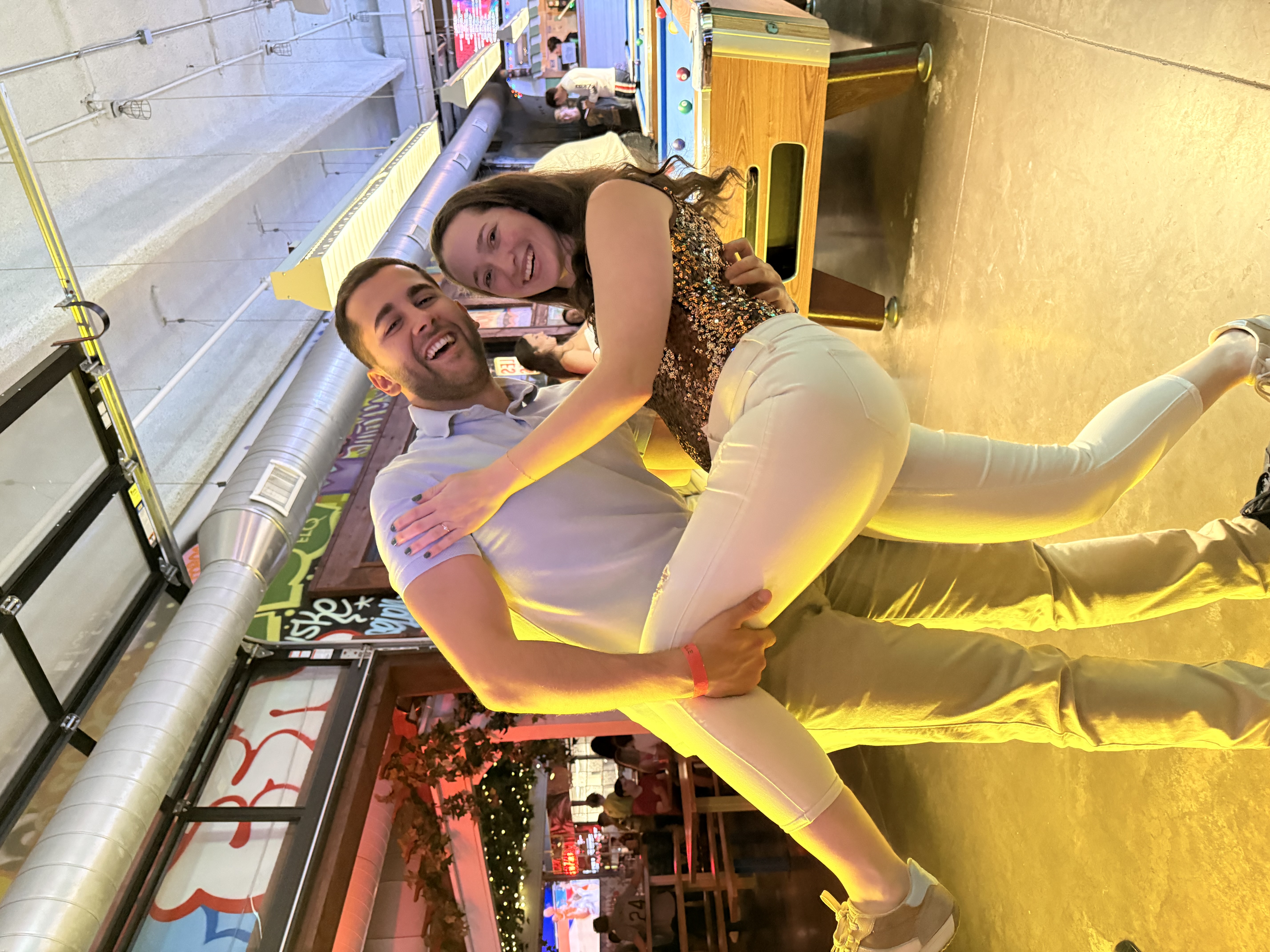 Katelyn and Alvaro celebrating in their favorite photo pose