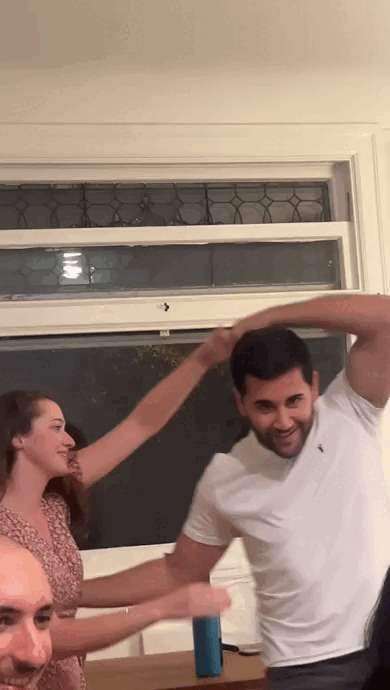 Katelyn and Alvaro salsa dancing together