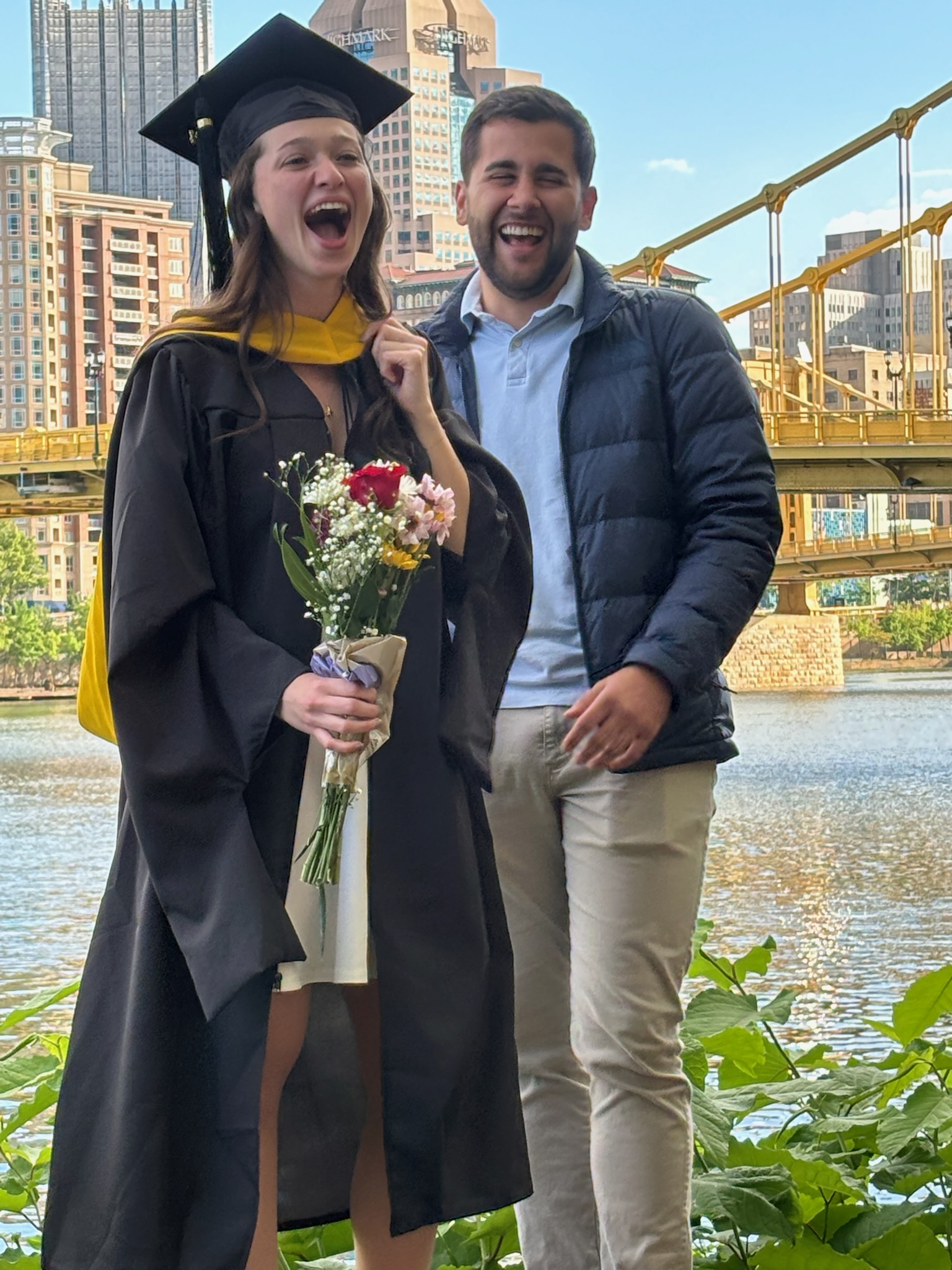 Katelyn and Alvaro celebrating Katelyn's master's graduation